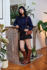 Bottes cavalières hautes à brides croisées et boucles